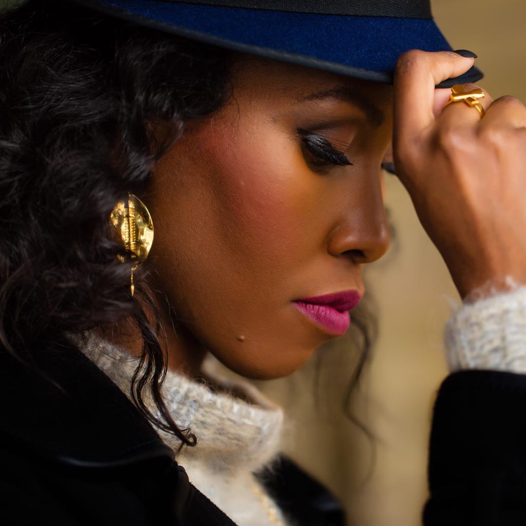 Model Wearing Dalasini Bulawayo Gold Shield Earrings