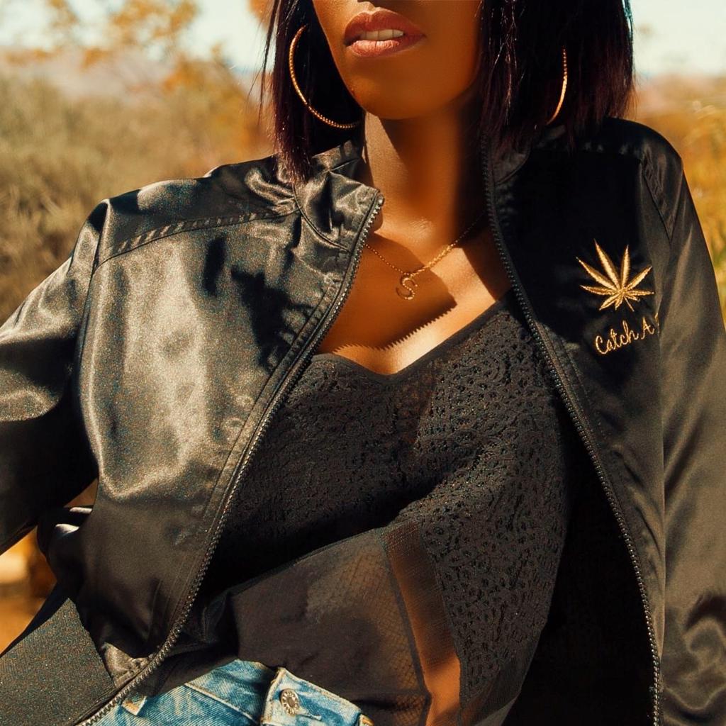 Model Wearing Dalasini Isiro Gold Vertebrae Letter Charm Necklace and Hoops