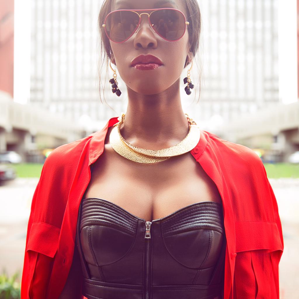 Model Wearing Dalasini Mara Hammered Gold and Paper Bead Earrings in Black