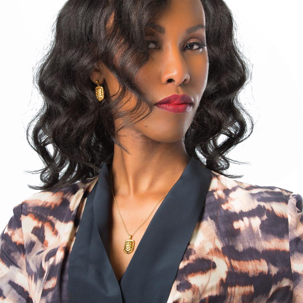 Model Wearing Dalasini Sahel Gold Tortoise Shell Necklace and Earring